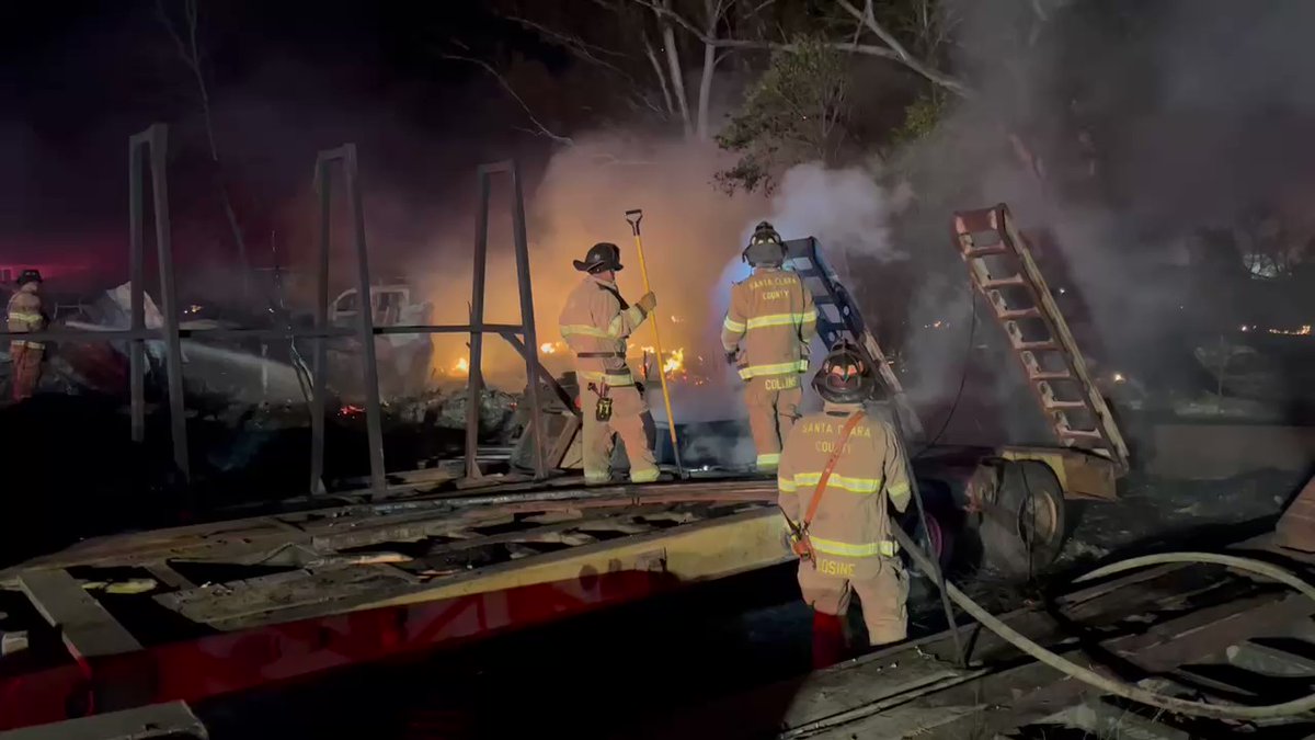 Dozens of firefighters still on scene in southern San Jose, almost Morgan Hill at the scene of this fire. It's burning across at least two residential lots, burning multiple buildings, including at a commercial site next door. 