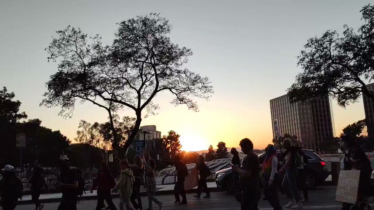 The sun is setting, but abortion rights protesters are not done out here