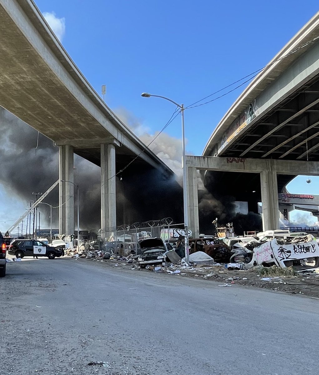 Emergency units are on scene for fire near encampment in Oakland