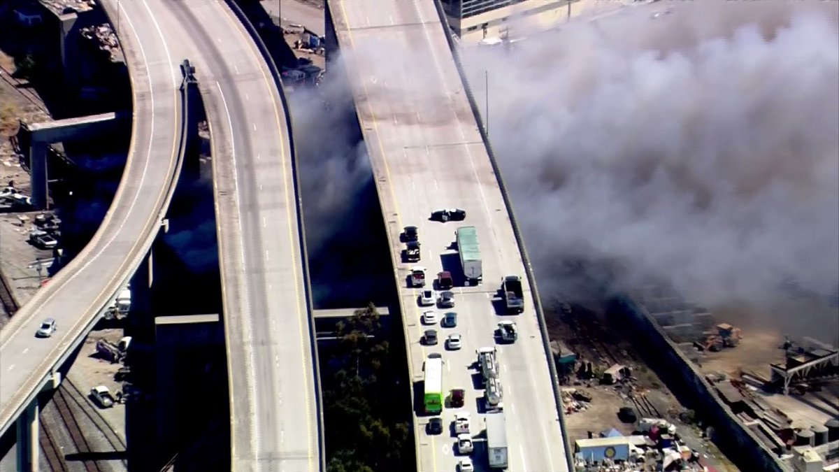 Firefighters continue to battle a blaze burning in the area of 34th and Wood streets in Oakland