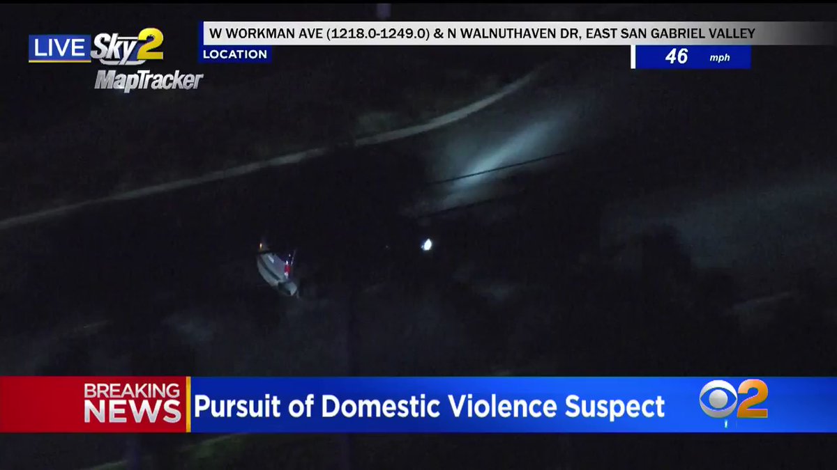 The vehicle chase portion of the pursuit has ended after @WestCovinaPD shoved the suspect's vehicle into a parked car, pinning him. The suspect is still in the car refusing to get out.