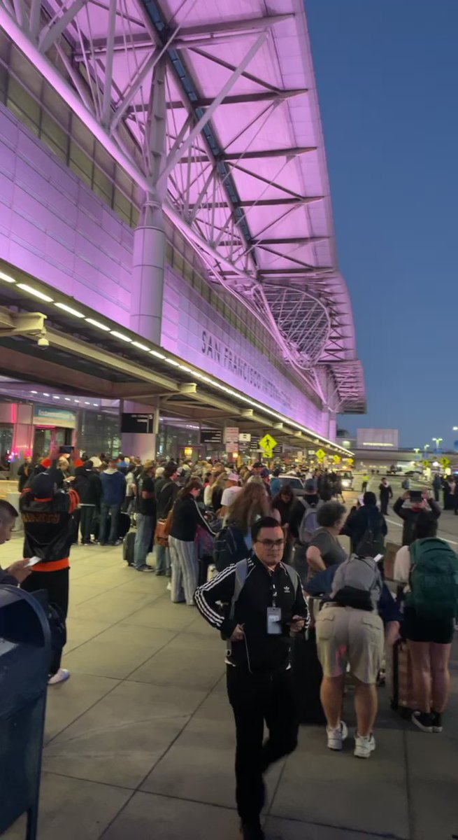 SFO International terminal evacuated due to 'police activity.' Thousands of passengers seen waiting outside in social media videos. San Francisco SFO