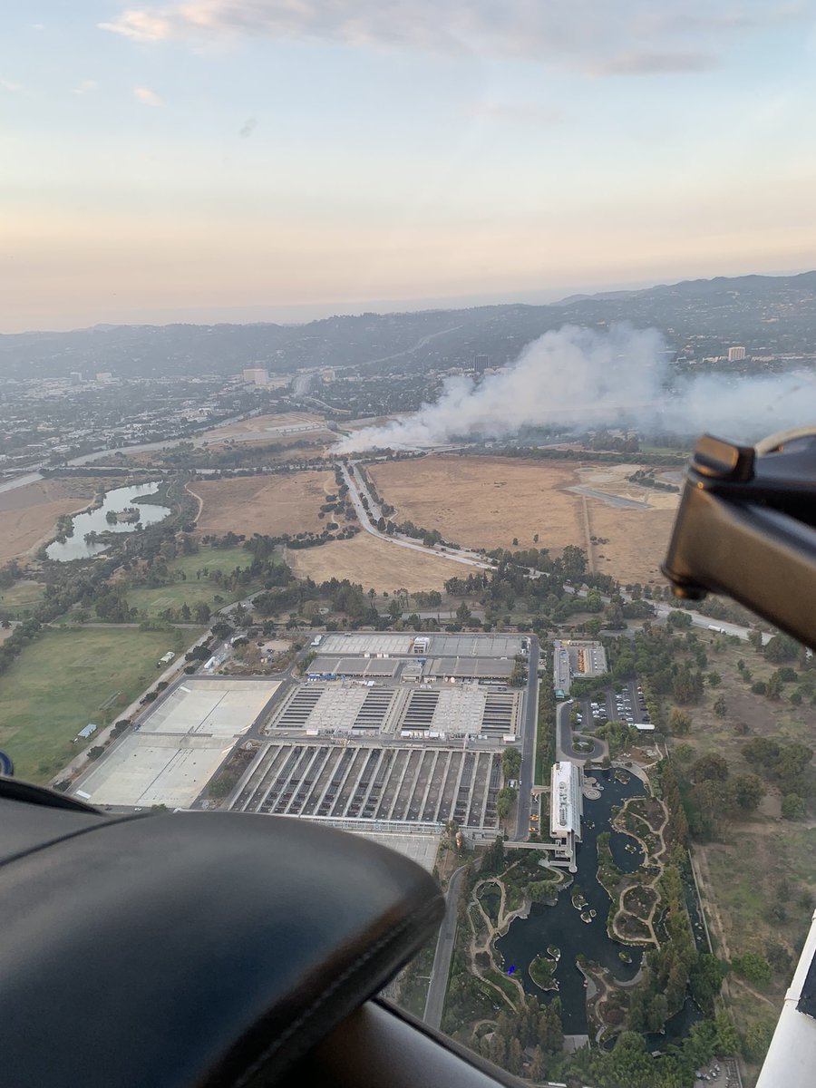 Small Grass Fire in the Sepulveda Basin.  About 1/4 Acre.  @LAFD has the Right Lane Blocked on Burbank Blvd EB at Woodley