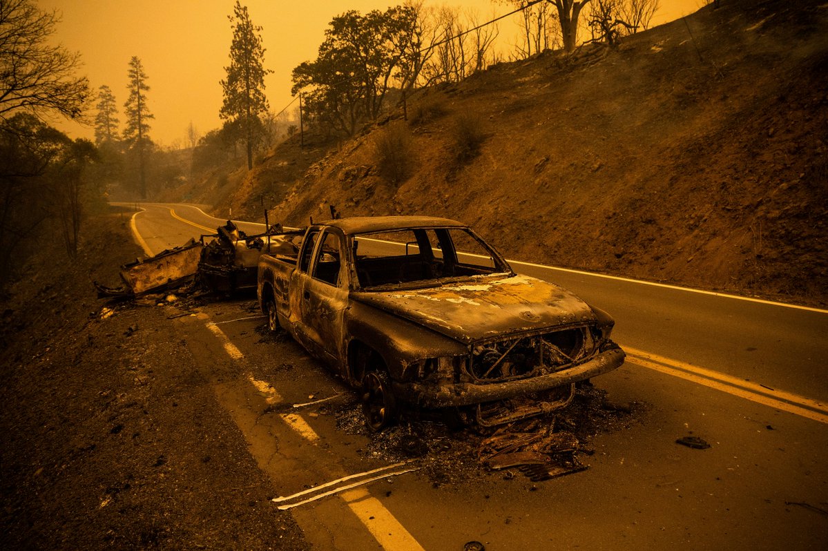 Two bodies were found inside a charred vehicle in a driveway in the wildfire zone of a raging California blaze that is among several burning in the western U.S. amid hot, dry and gusty conditions that boost the danger that the fires will keep growing