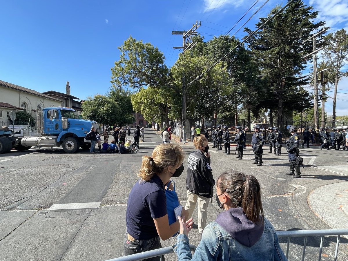 Protestors trying to save People's Park in Berkeley have blocked a truck carrying tree trimming equipment.  Several other tree trucks made it.  Workers have begun cutting down trees in park to make way for construction of new housing for 1100 Cal students and 125 homeless people