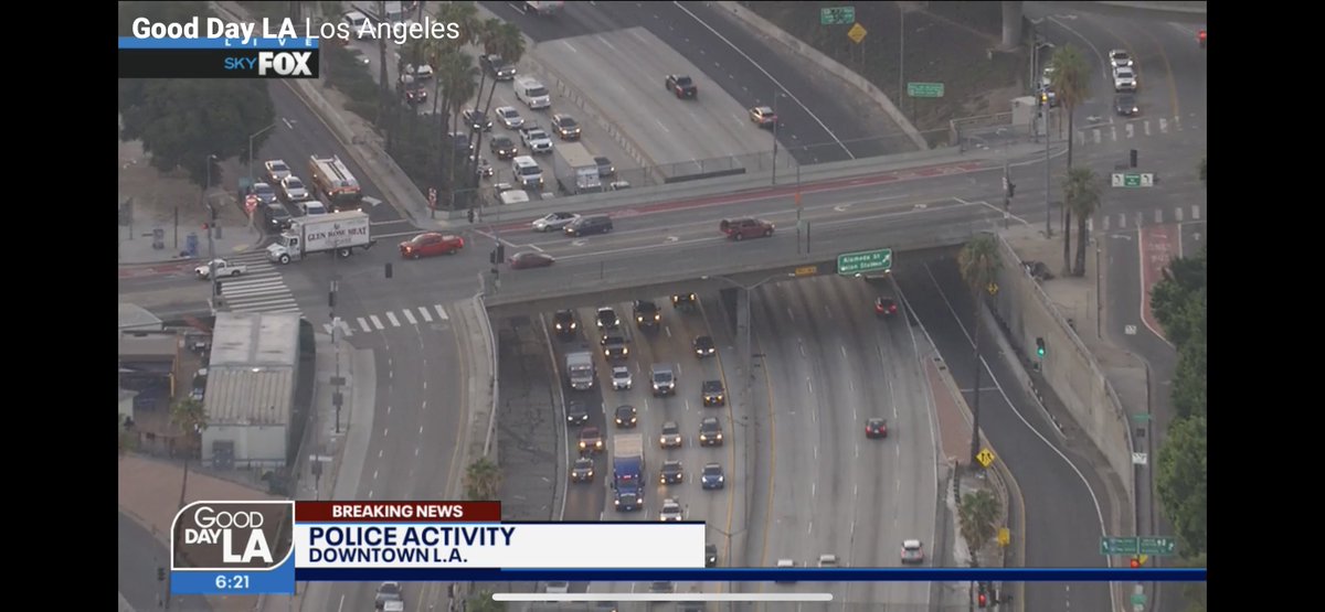 Man hanging over overpass on the 101 freeway near Los Angeles Street in DTLA.  LAFD and CHP on scene. Freeway shut down. Avoid area as they hopefully talk this man down safely