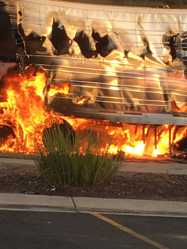 A semi-truck driver is dead after crashing into an ongoing train in Kingsburg, then goes up in flames with several explosions.  