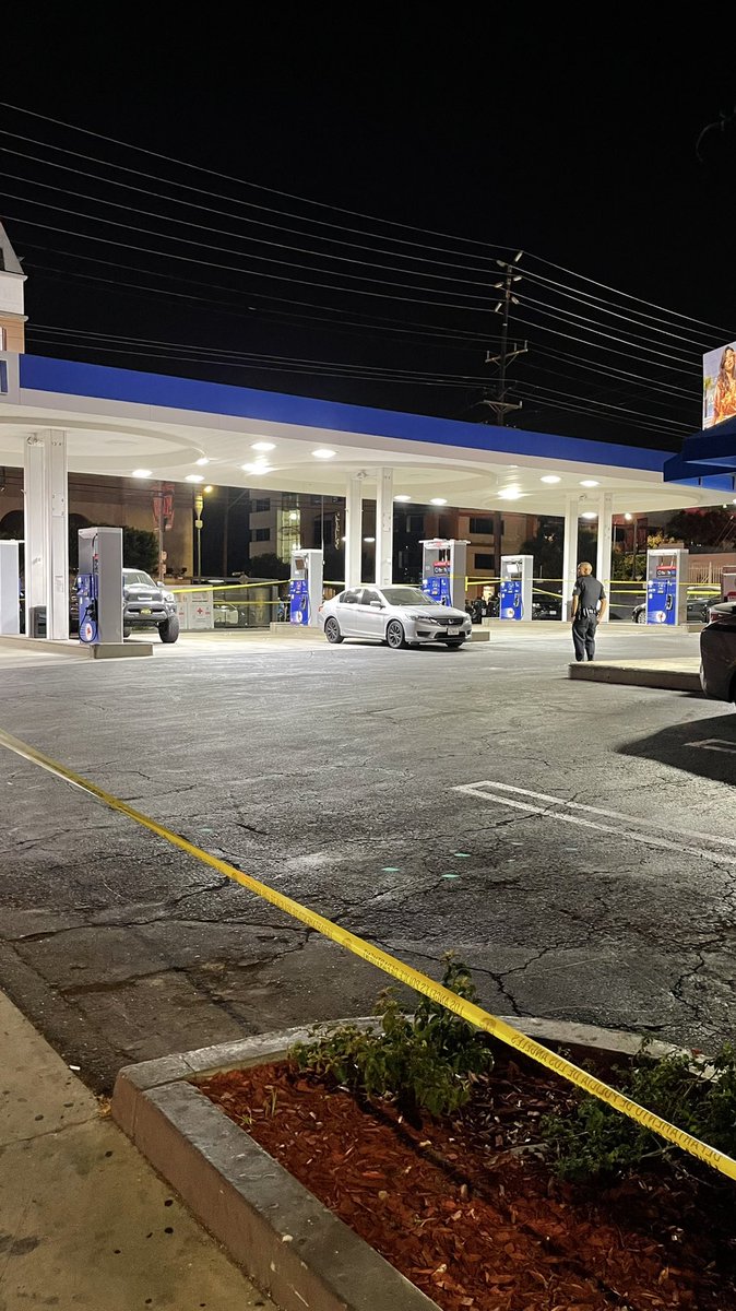 Photos of Mobile Gas station and San Vicente Blvd closed to traffic outside