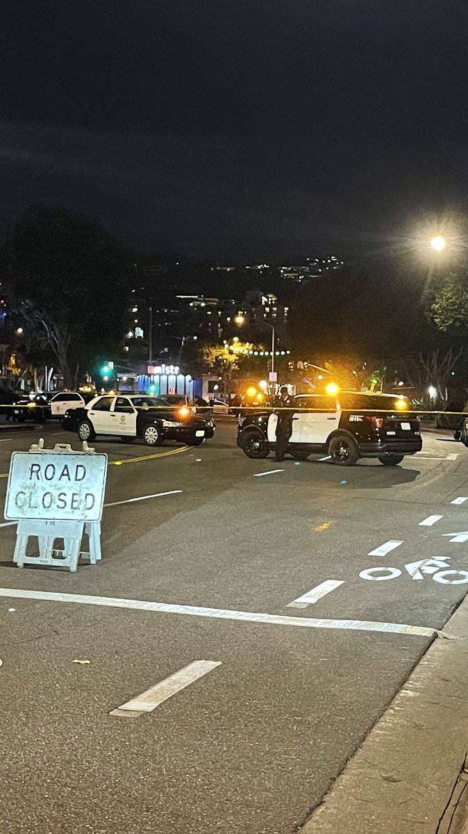 Photos of Mobile Gas station and San Vicente Blvd closed to traffic outside 