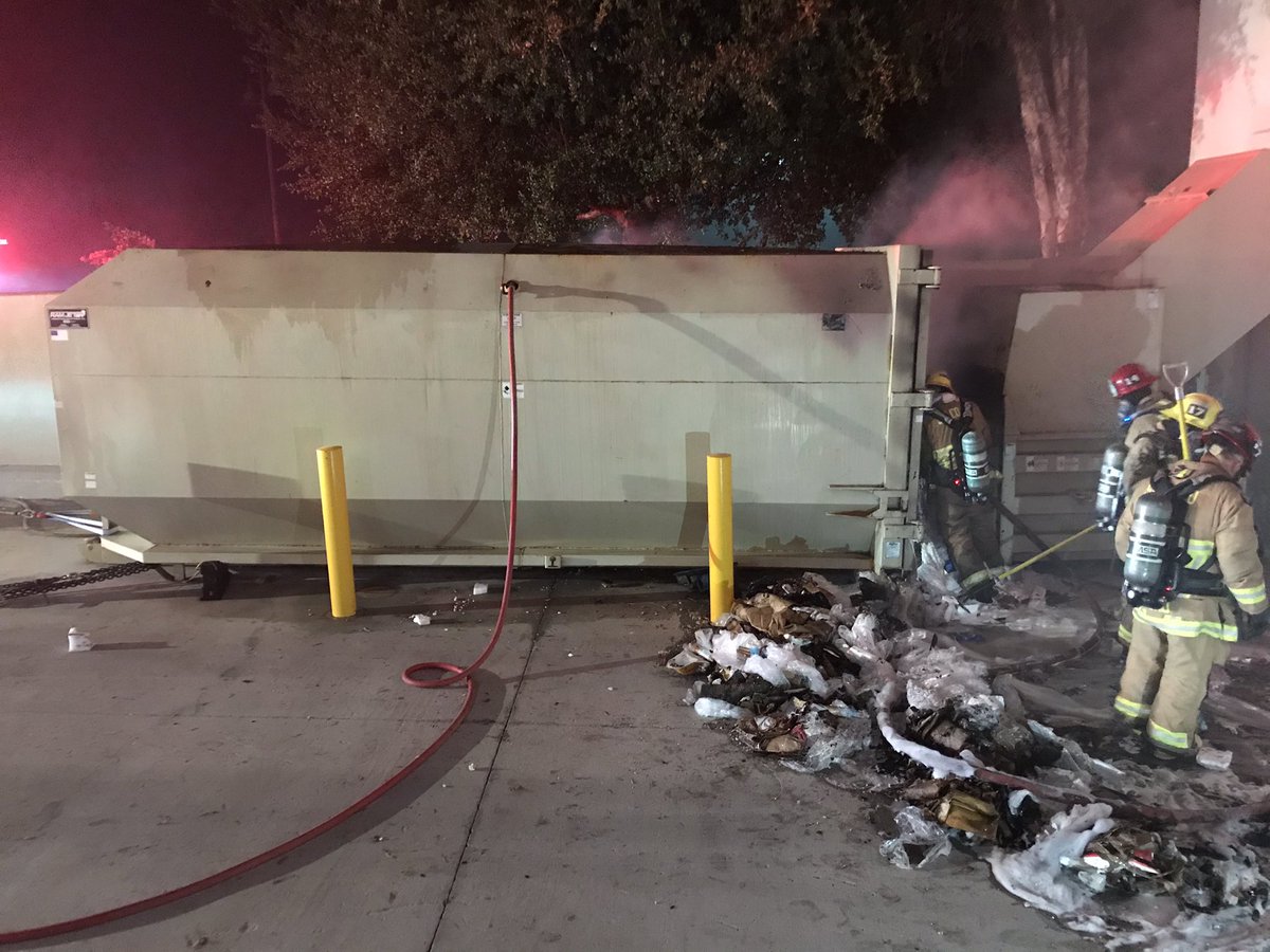 Structure Fire: 7055 Market Pl. Dr./Goleta. Trash Compactor Fire 10'x10'x20' Behind Ross Dept. Store/Workers arrived this morning, called 911.  Heavy smoke damage to stock room with light smoke thought store building. Fire Controlled/50min. Mop-up phase/under investigation. 