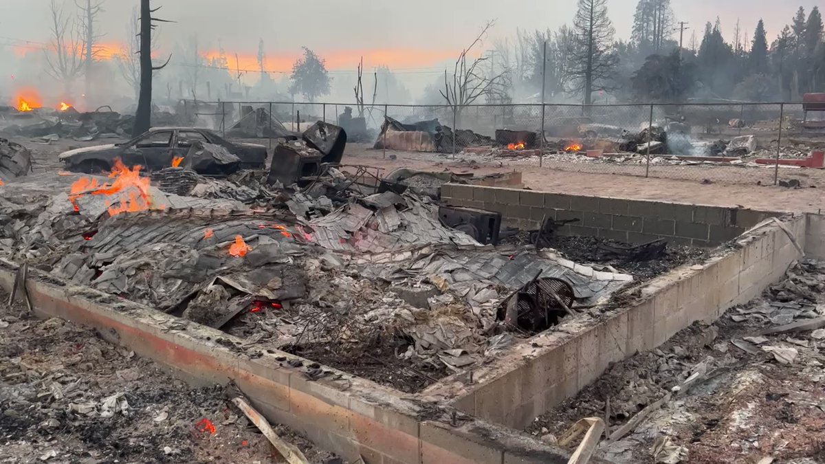 MillFire and a devastated neighborhood between Railroad Ave and E Lincoln Ave Weed CA