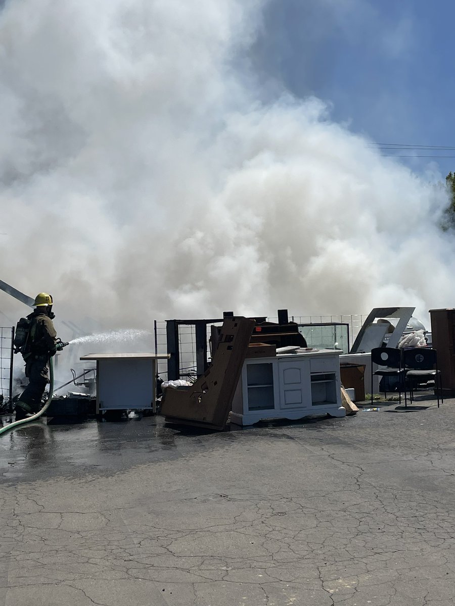 Olivefire Firefighters are making good progress, the building is partially involved with the majority of the fire coming from contents on the outside of it. Olive highway is closed in the area of the fire