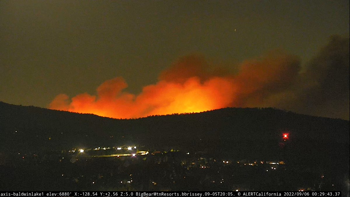 RadfordFire is still burning towards the north & west approx a mile south of Snow Summit. Lots of embers getting kicked up towards the ridgeline. The fire has not crossed 2N10 at this time. Photo from Hwy 38 looking north, Baldwin Lake to the SW and Snow Summit looking south