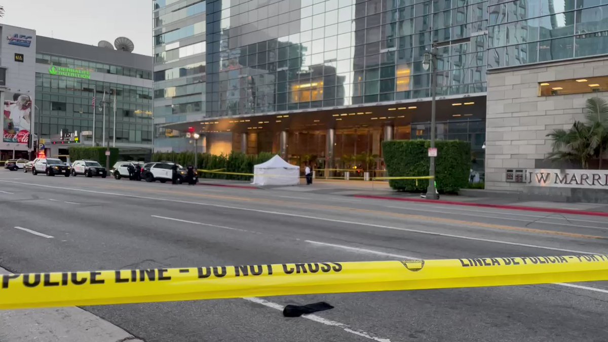 Man shot and killed in front of JW Marriott in Downtown LA. Police say suspect vehicle is a white Rolls Royce. 3 suspects in white Rolls described as male Hispanic or Caucasians with dark hair per