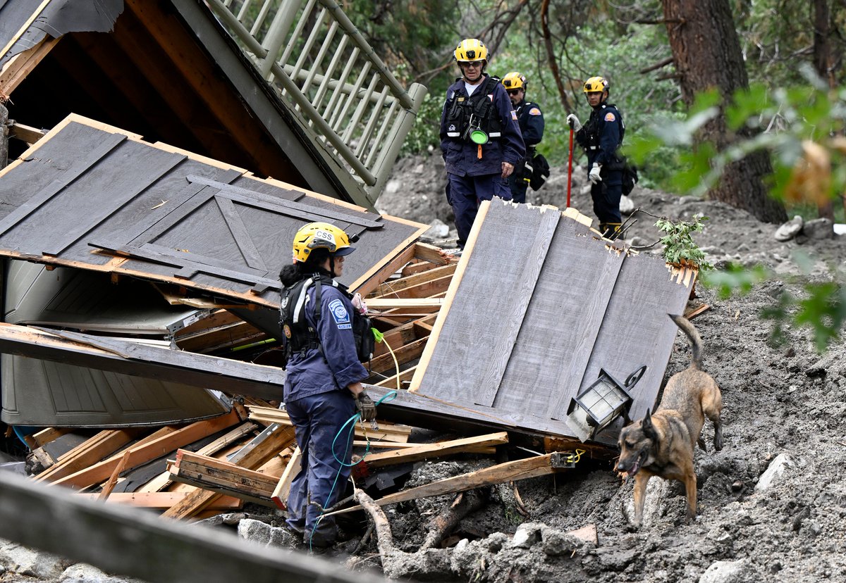 Search and rescue teams search mud flow damaged homes in ForestFalls Tuesday. A large thunderstorm moved through the area Monday afternoon resulting in a flash flood/mud flow heavily damaging at least 4 homes