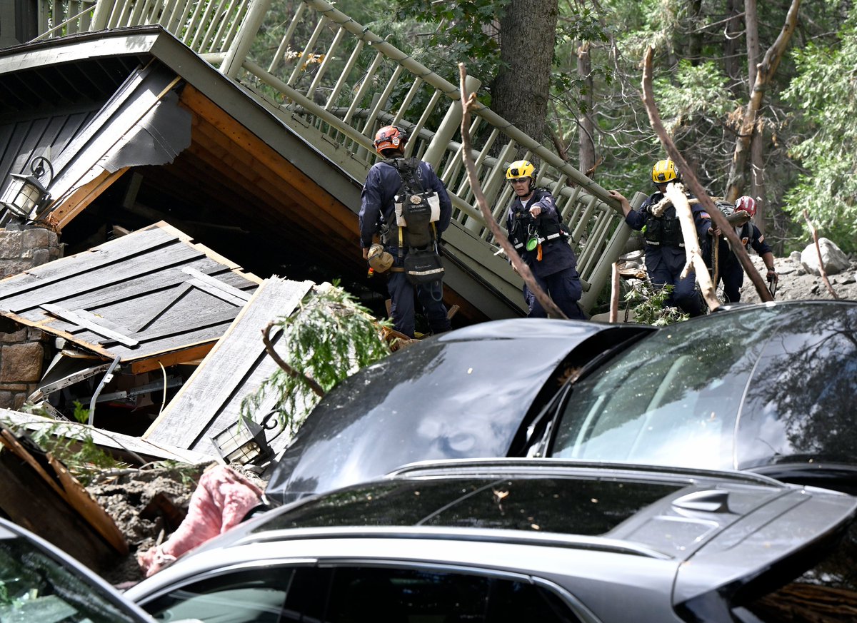 Search and rescue teams search mud flow damaged homes in ForestFalls Tuesday. A large thunderstorm moved through the area Monday afternoon resulting in a flash flood/mud flow heavily damaging at least 4 homes