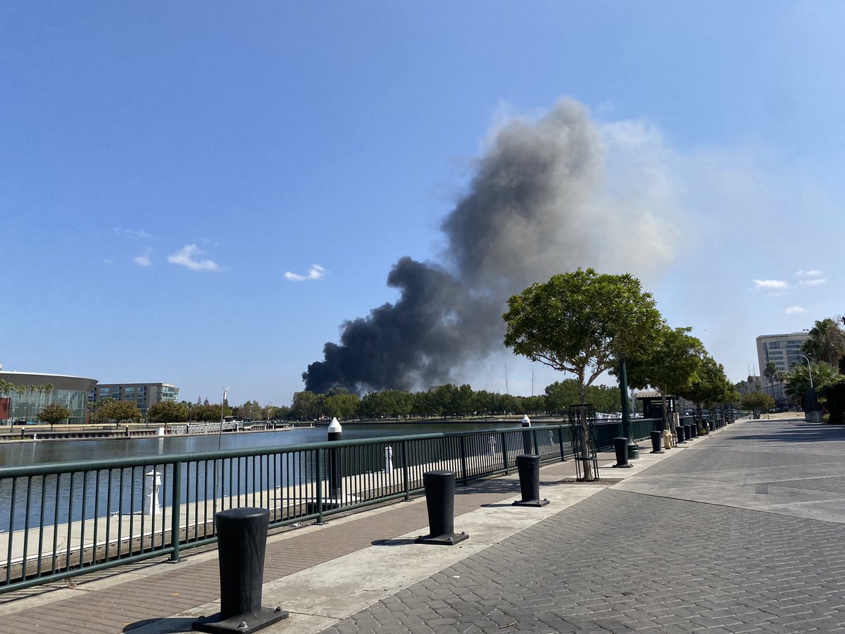 Fire crews in Stockton battling a two alarm fire at a warehouse downtown putting up a massive plume of black smoke. This is in the area of Hunter and Oak Streets.