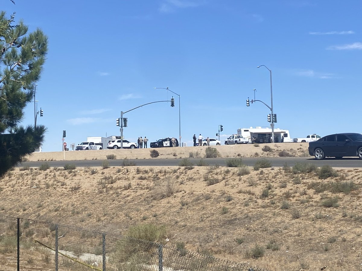 Witnesses tell sheriff's deputies took cover behind this white SUV as they exchanged gunfire with the suspect linked to yesterday's deadly shooting near a Fontana school. This is in Hesperia. Suspect has died, and his 15 year-old daughter is hospitalized, authorities say