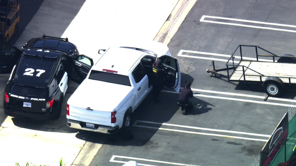 Barricade Costa Mesa DOJ serving a search warrant during entry one shot was fired from inside the building no officers hit now a standoff. Sunset Dr & Monrovia Ave  