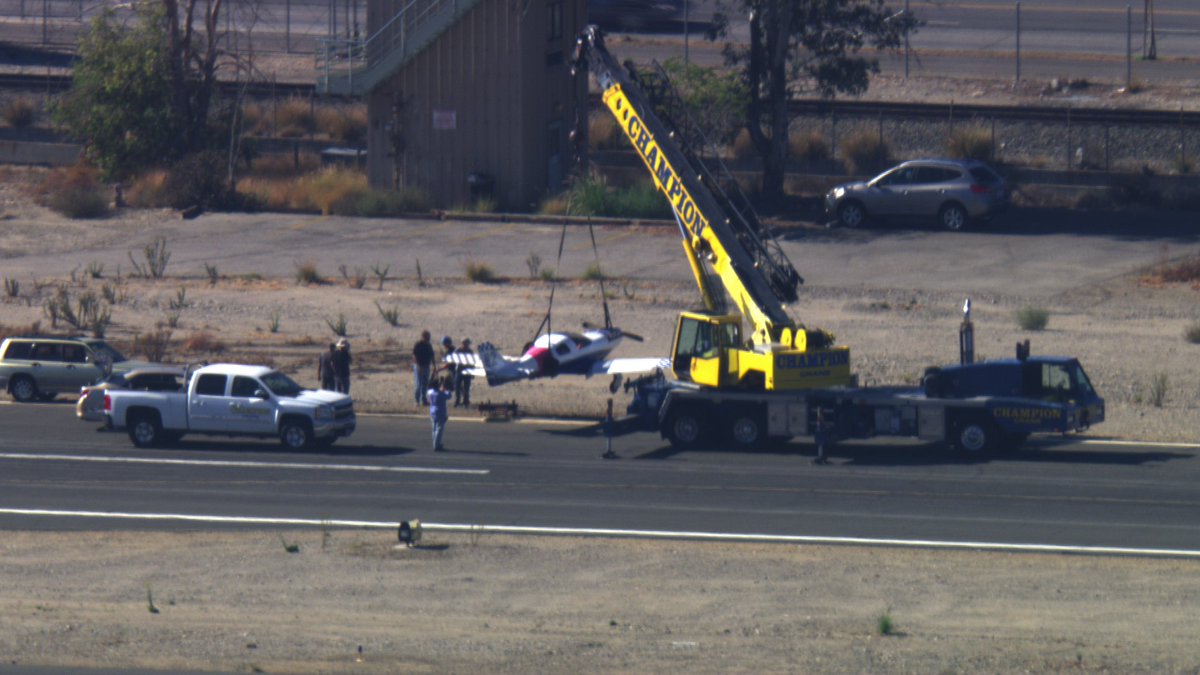 Whiteman Airport another day in aviation small plane off the runway getting a tow back to the hanger