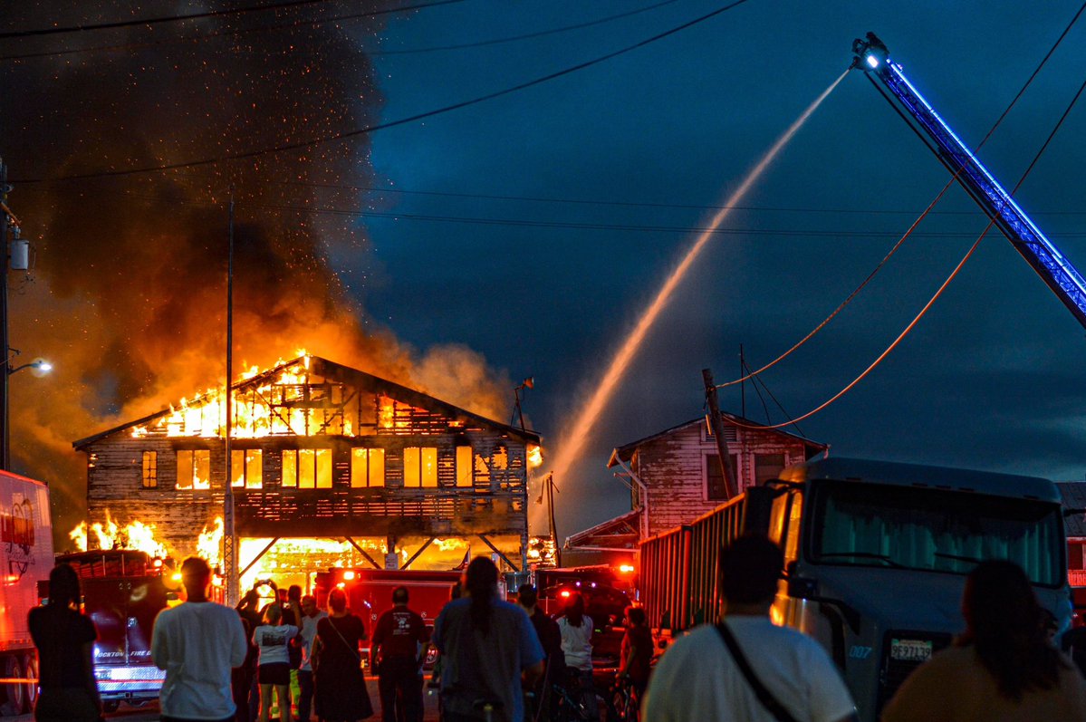 Firefighters battle the fire on the waterfront of an abandoned building on Fremont and Stockton Streets. stockton fire Christian Santos