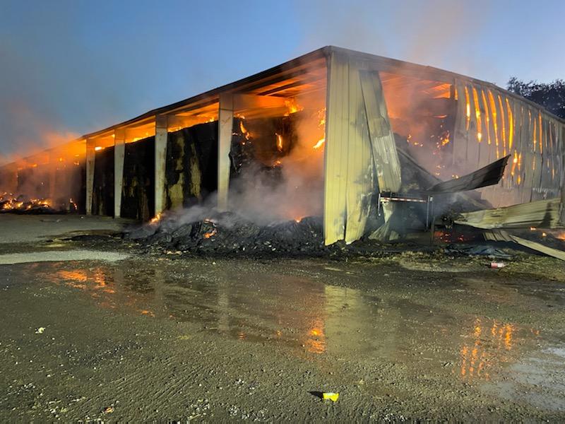 Firefighters are at scene of a Hay bay Fire in a large metal hay barn off of W Biggs Gridley Rd. Firefighters protecting Residences around the building as well as trying to extinguish the fire