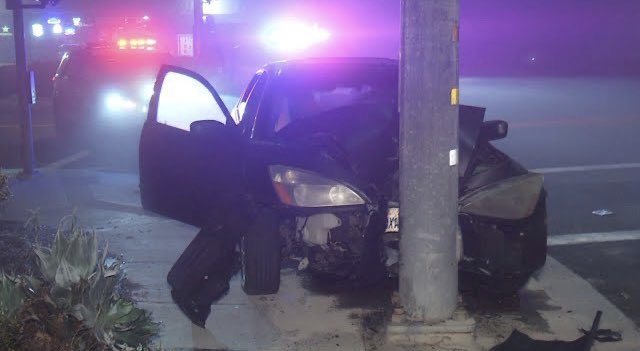 The occupant of a Honda sedan was found unconscious after the vehicle crashed into a pole in Oceanside Saturday night.