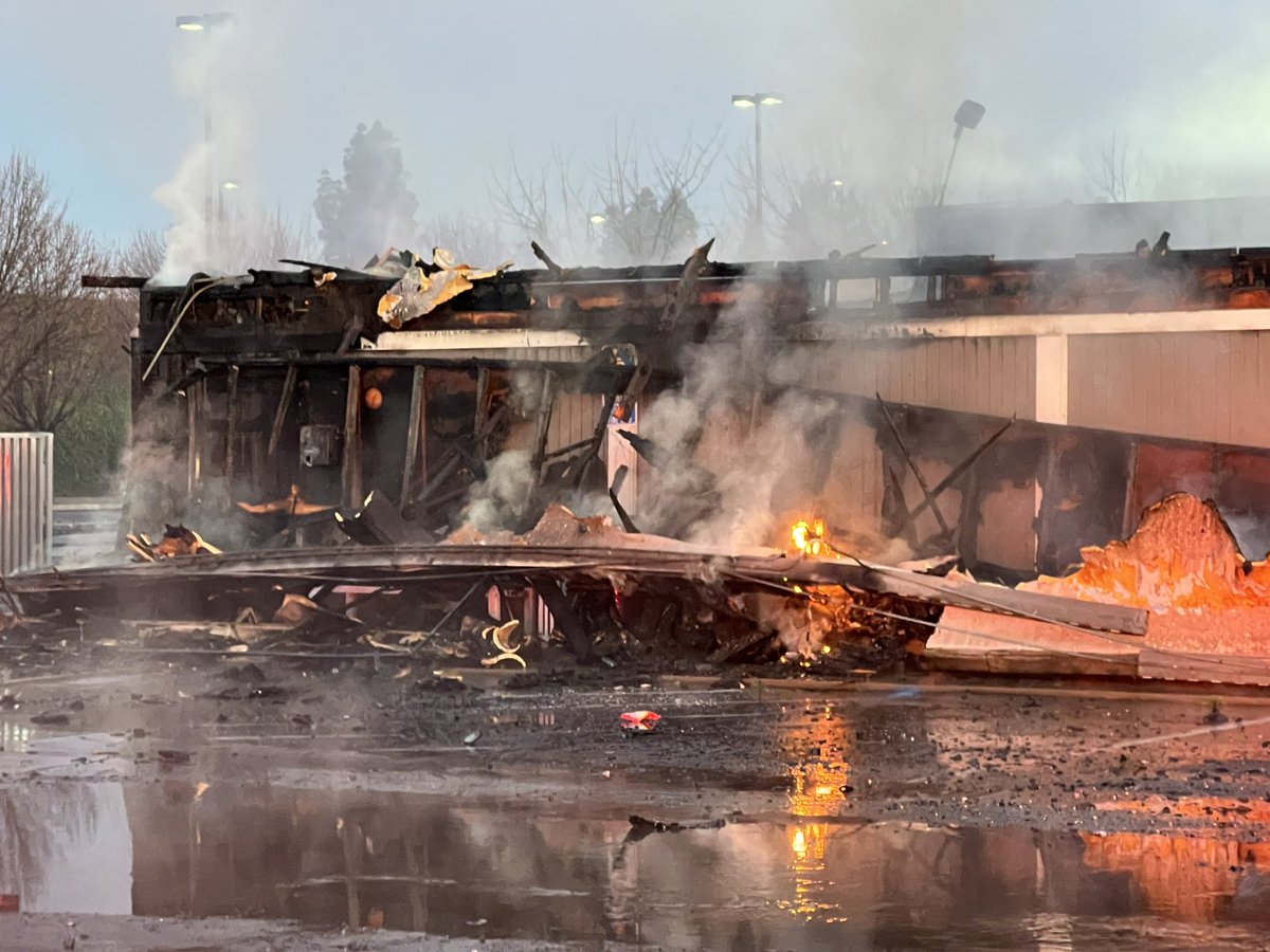 Now that the sun is coming up, you can see the damage caused by the early-morning fire at the strip mall. Sunnyside Deli was saved. The owner says there was a dance studio, hair salon, barber shop, pharmacy and Sullivan's to the west of the deli. Those are a total loss