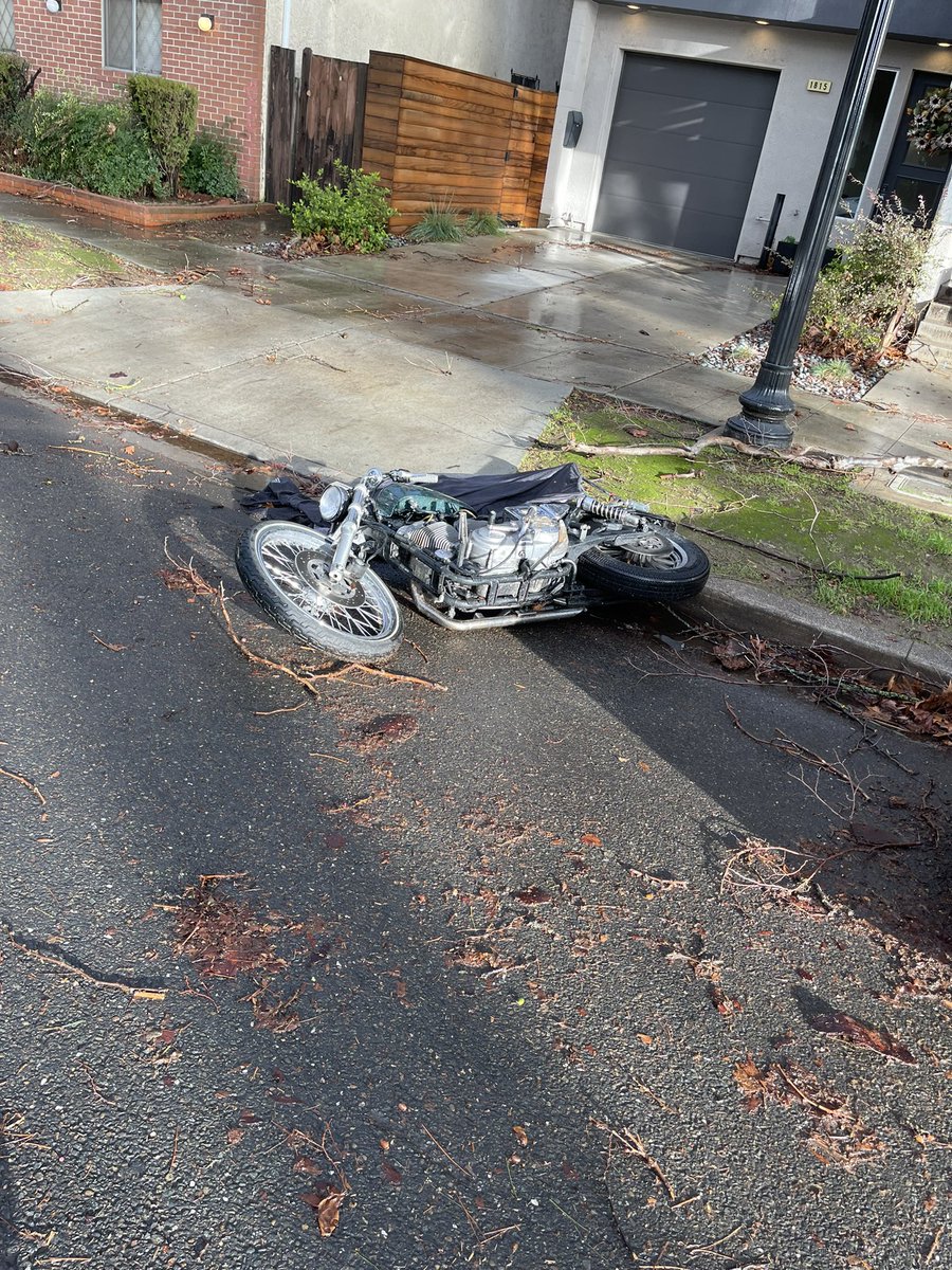 The morning after nearly 70mph winds hit midtown Sacramento last night. This is at T & 19th, you can see someone's motorcycle on its side  