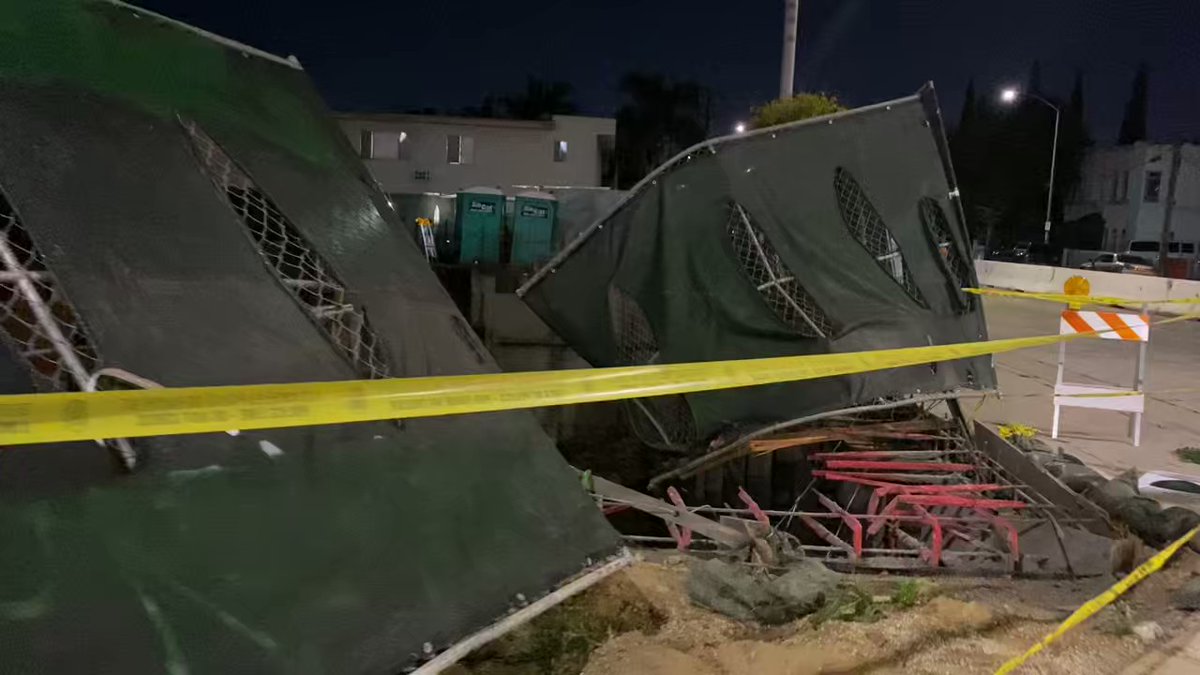 Police say the suspect in a late night shooting and carjacking crashed into this Boyle Heights construction site as he was trying to flee. He is now in custody