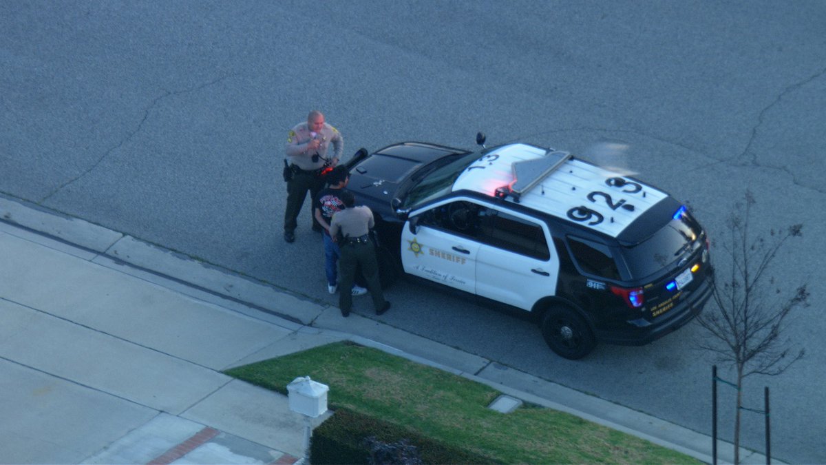 Fire deputies from Lakewood Sheriff Station brave the flames checking for victims. The 2 occupants got out and ran. But caught near by. This all happening in Cerritos at 195th & Pioneer 