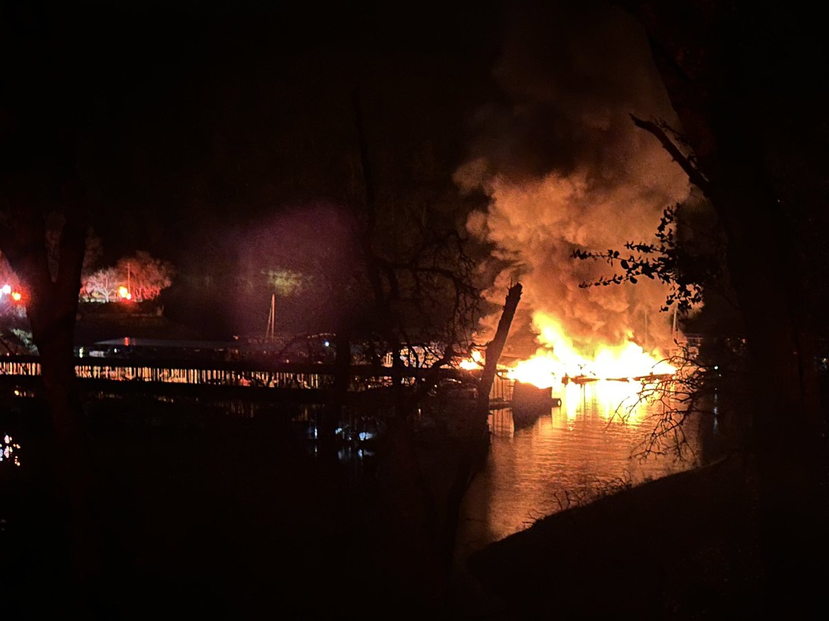 Forward progress has stopped on the dock, but an active burning area of the dock has detached and is floating independently on its own