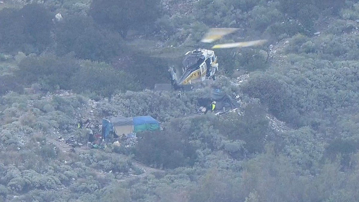 At least 7 people rescued from what appears to be a homeless camp in the San Gabriel Rive in Azusa. Quickly rising waters appear to have caught the group off guard