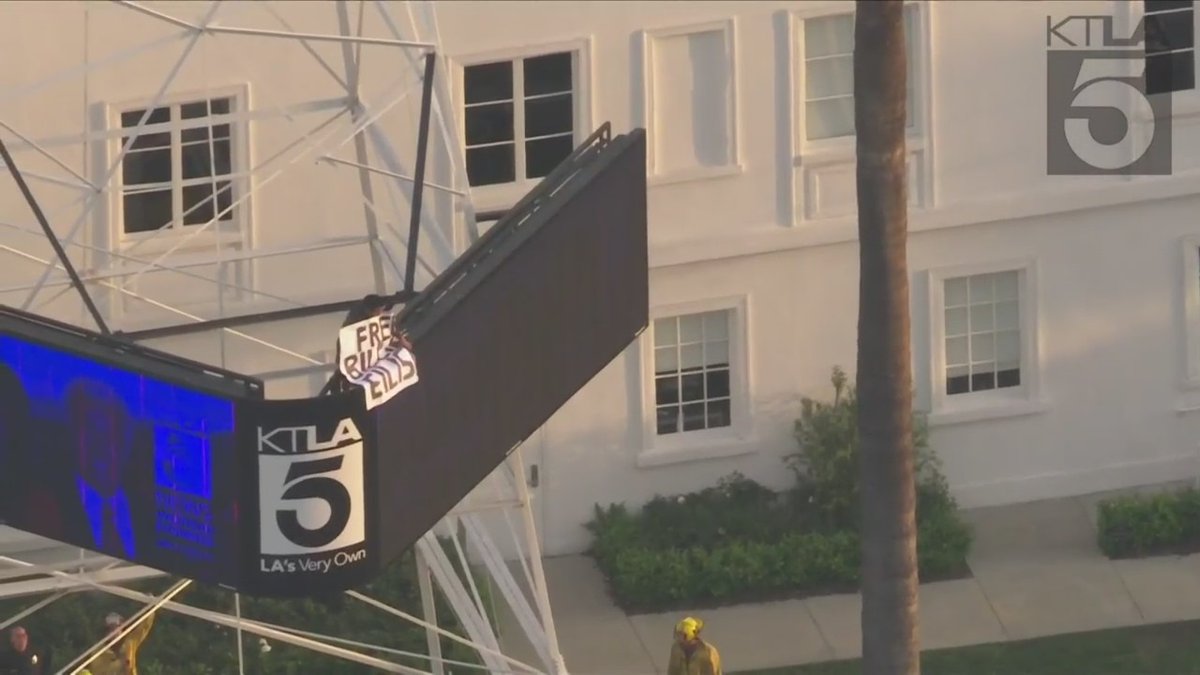 Police and firefighters are responding to a man who has climbed up a portion of the KTLA 5 News tower in Hollywood.