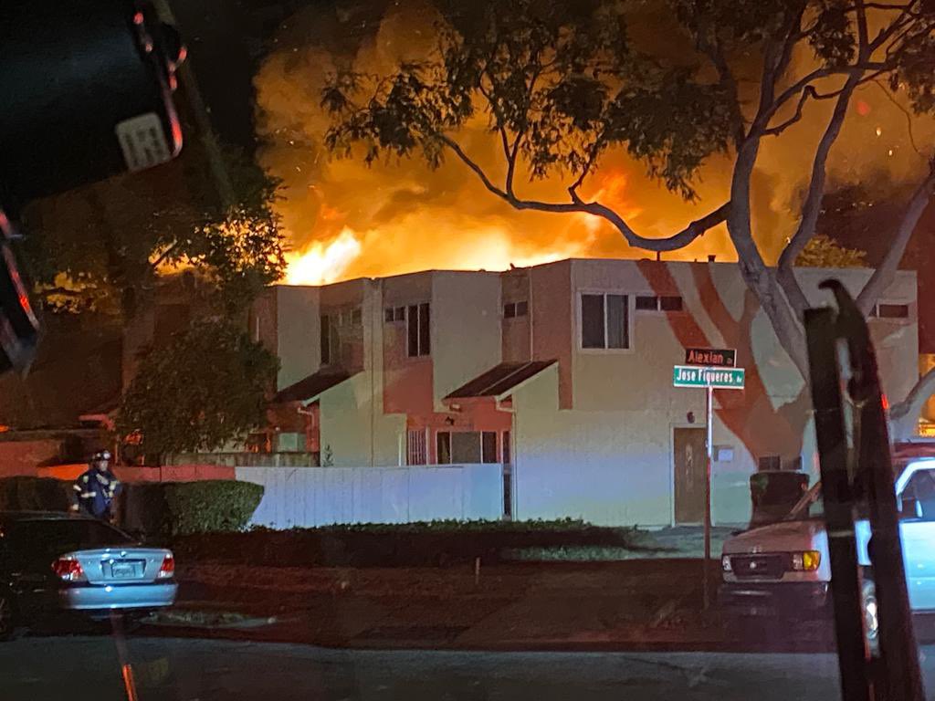 Crews battled a four-alarm fire on the 2100 block of Luz Ave. Fire was in five of seven units in townhouse complex. 30  residents displaced, one deceased dog, no additional injuries. nnFire knocked down and situation under control. Red Cross en route.
