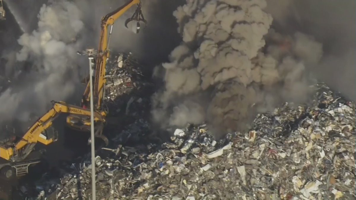 Fire burning in debris pile at Schnitzer Steel near the Port of Oakland. Smoke can be seen from miles away. There have been fires at Schnitzer Steel in the past.