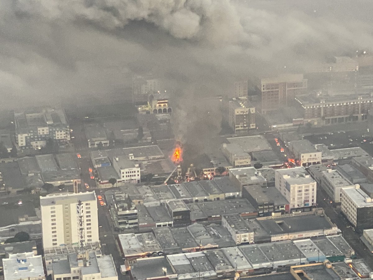 Commercial building fire in DTLA in the GarmentDistrict in a textile store. This is near Los Angeles St.and 11th. 