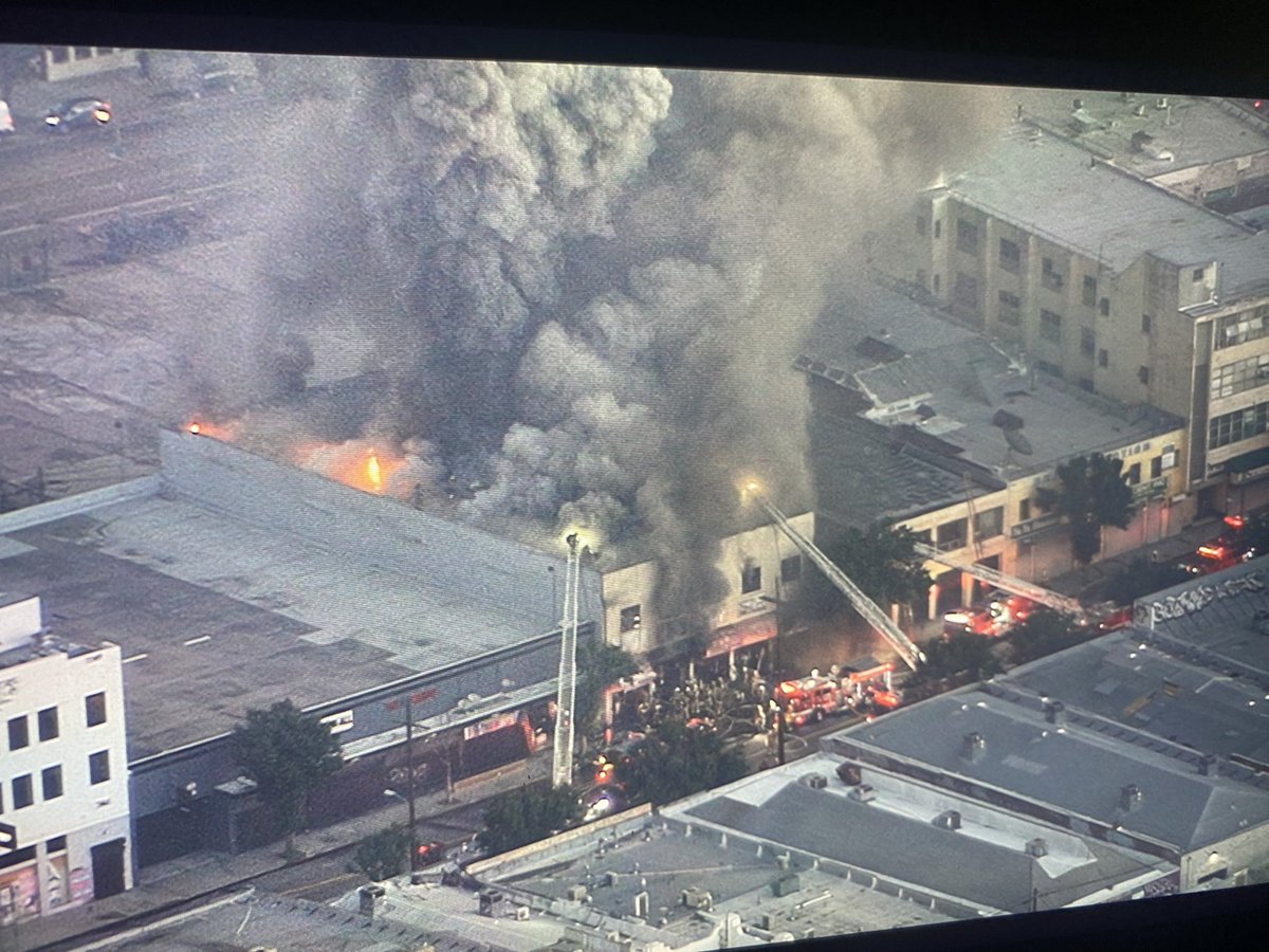 Commercial building fire in DTLA in the GarmentDistrict in a textile store. This is near Los Angeles St.and 11th. 