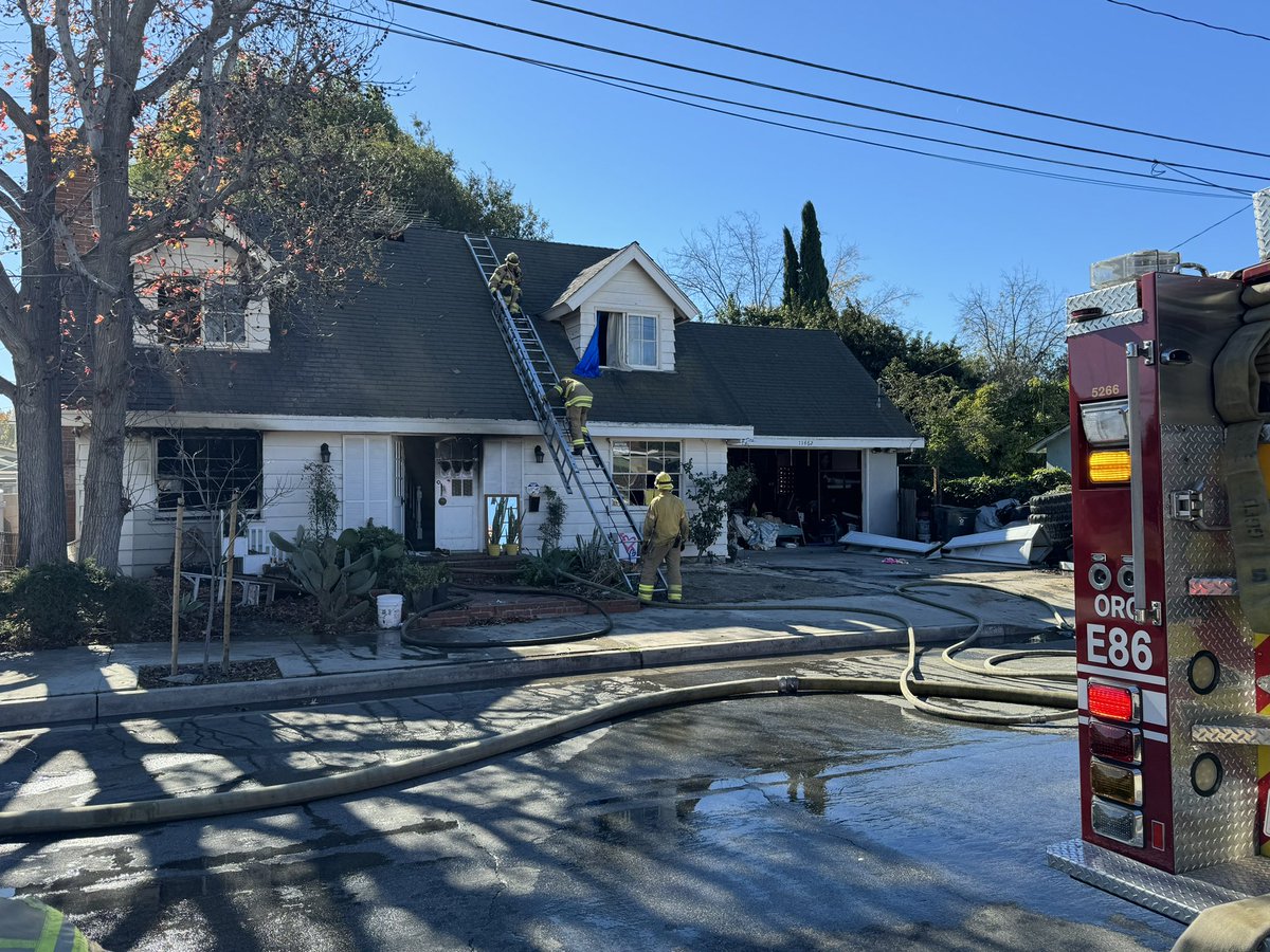 Dispatched, firefighters were on scene of a house fire in the 11400 block of Stanford Ave. in @CityGardenGrove with flames out the first-floor windows.