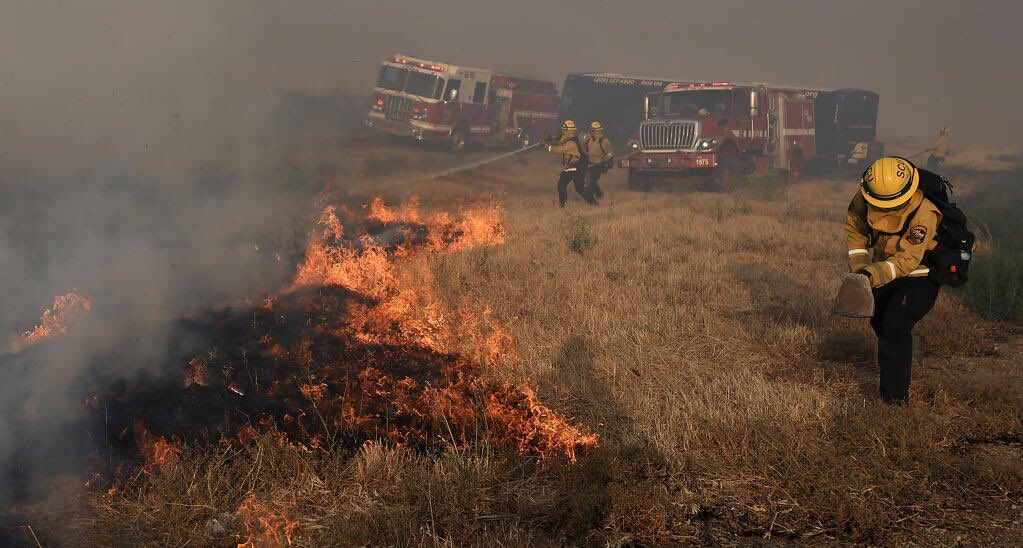 The CorralFire burns 11k acres along I-580 near Tracy, on a hot and extremely windy afternoon, prompting evacuations