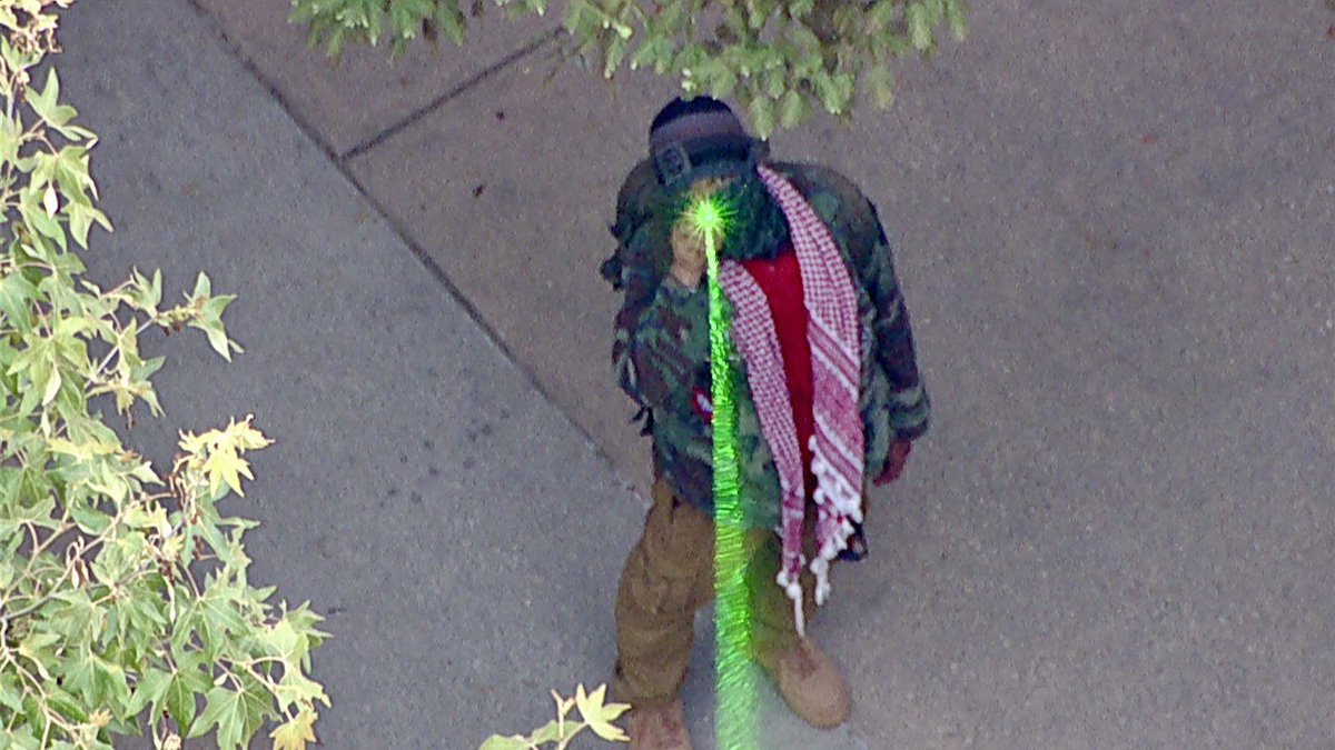 Laser attack as CHP and UCLA police prepare to move in on a large menacing crowd attempting to barricade themselves in a campus courtyard