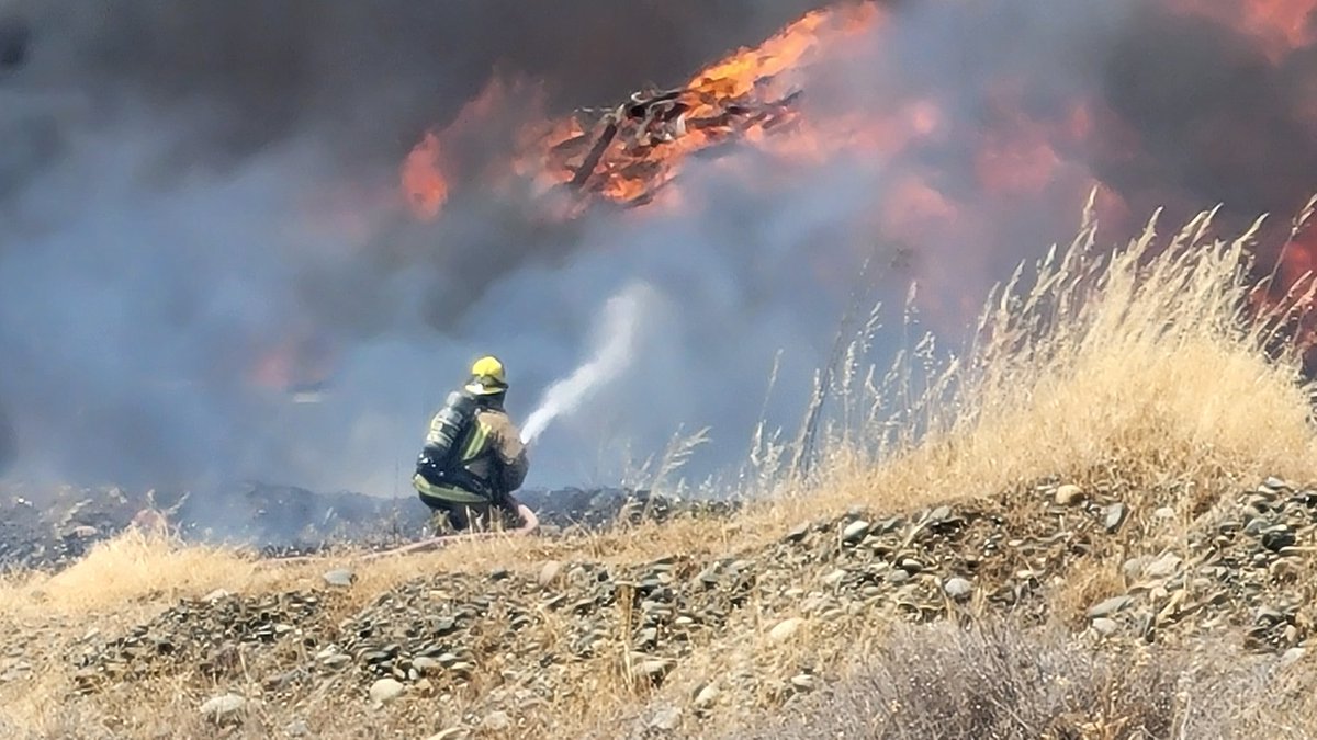 Fire off Georgia Pacific Way and Merlo Avenue. Large pile of materials burning