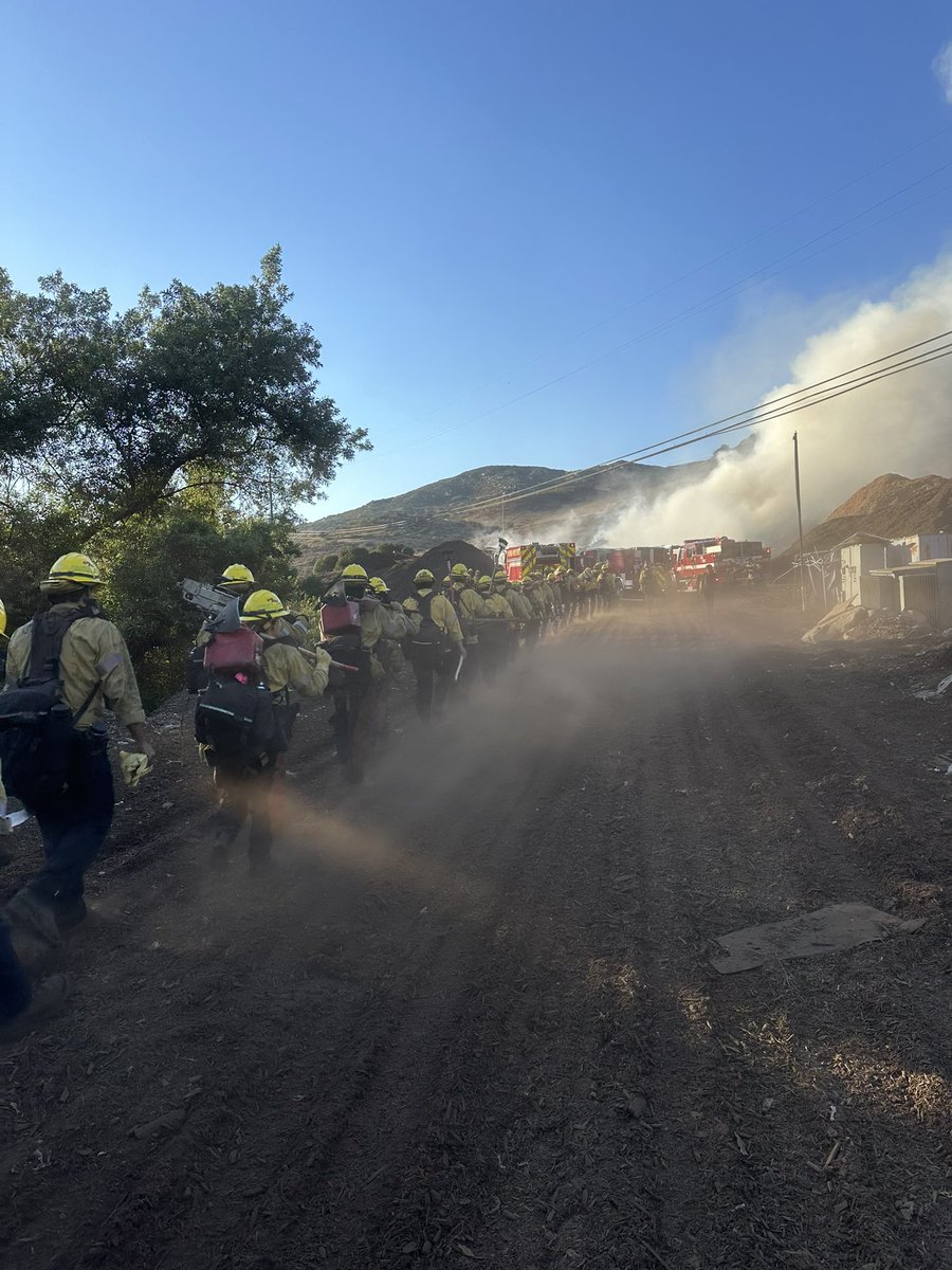 .@CALFIRESANDIEGO firefighters are at scene of a large mulch pile fire in the 12000 block of Slaughterhouse Canyon Road in Lakeside. There is no extension into the vegetation and resources from the air and ground are making good progress