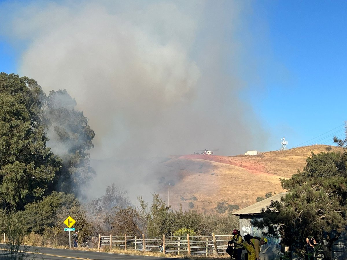 AmericaFire : Forward progress of the fire has been stopped and held at approximately 5 acres. Expect for crews to remain at scene for several more hours securing control lines and mopping up