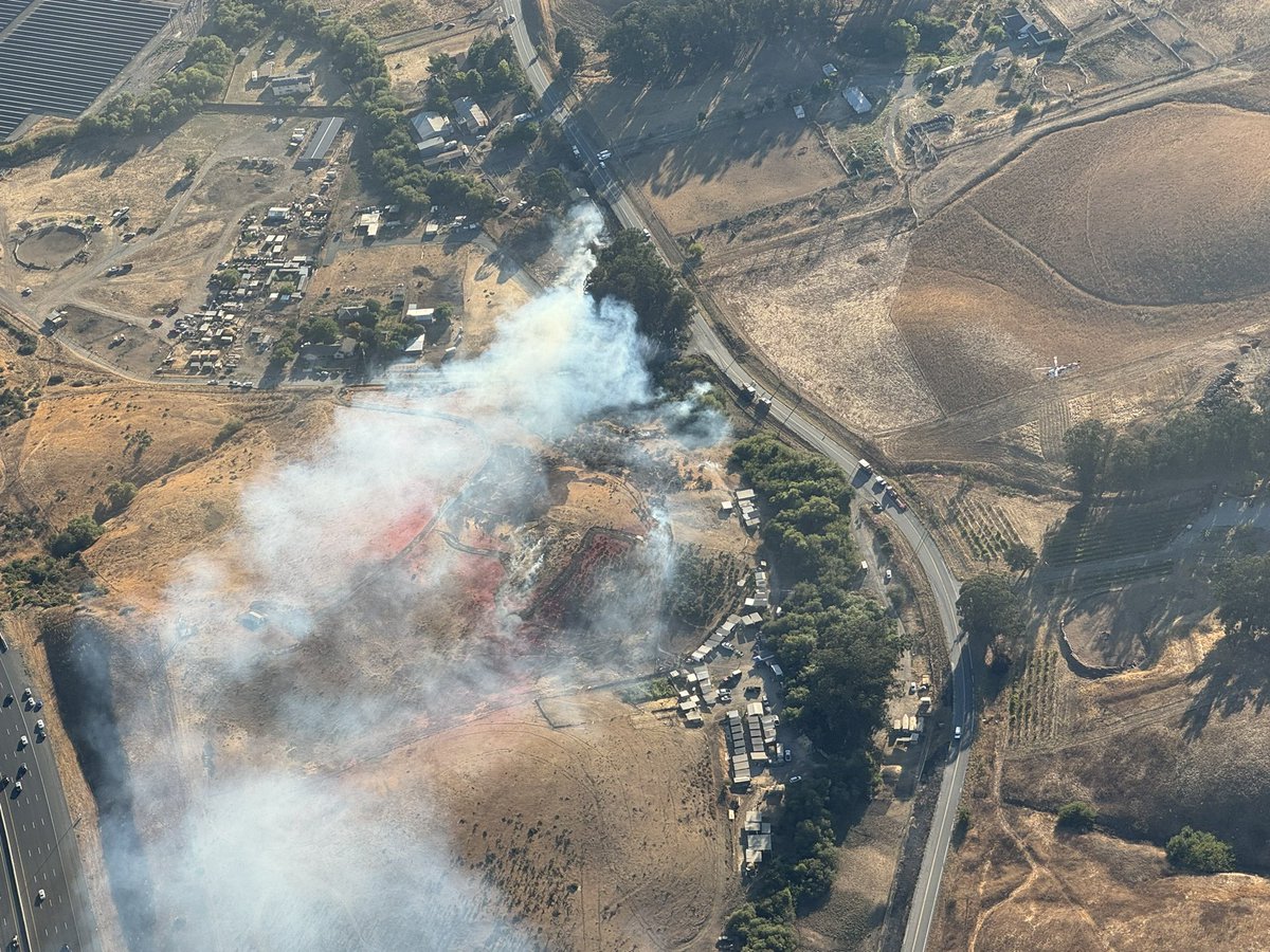 AmericaFire : Forward progress of the fire has been stopped and held at approximately 5 acres. Expect for crews to remain at scene for several more hours securing control lines and mopping up