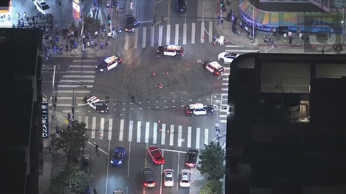 Some fans were seen looting a store and breaking windows in downtown Los Angeles as crowds took over the streets to celebrate the Dodgers' World Series win