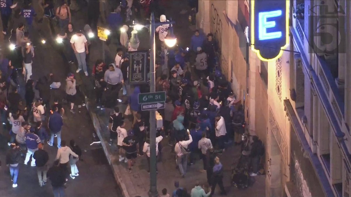 Some fans were seen looting a store and breaking windows in downtown Los Angeles as crowds took over the streets to celebrate the Dodgers' World Series win