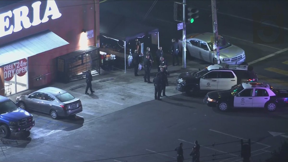 At least two police officers have been hospitalized for possible gunshot wounds after responding to a robbery in South Los Angeles on Friday night, LAPD reports