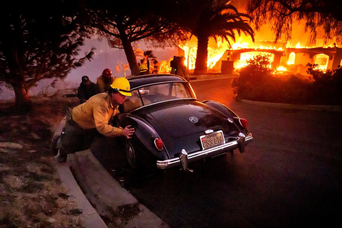 Thousands of people evacuated as wildfires ravage homes near Los Angeles