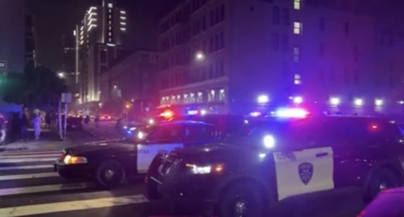 Sideshow at 16th & San Pablo Ave. Cars skate past @OICSharksIce Center & landmark Maclise Drugstore Bldg blocks from @Oakland City Hall. @BMW set on fire. @oaklandpoliceca arrive to disperse participants